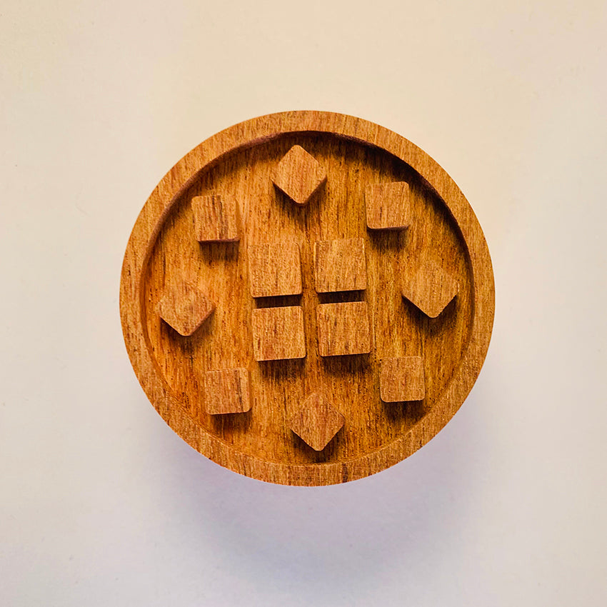 Wooden puzzle with heart shapes.