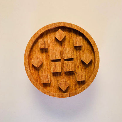 Wooden puzzle with heart shapes.