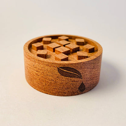 Wooden puzzle box with sliding squares .